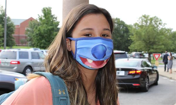student smiles on first day of school
